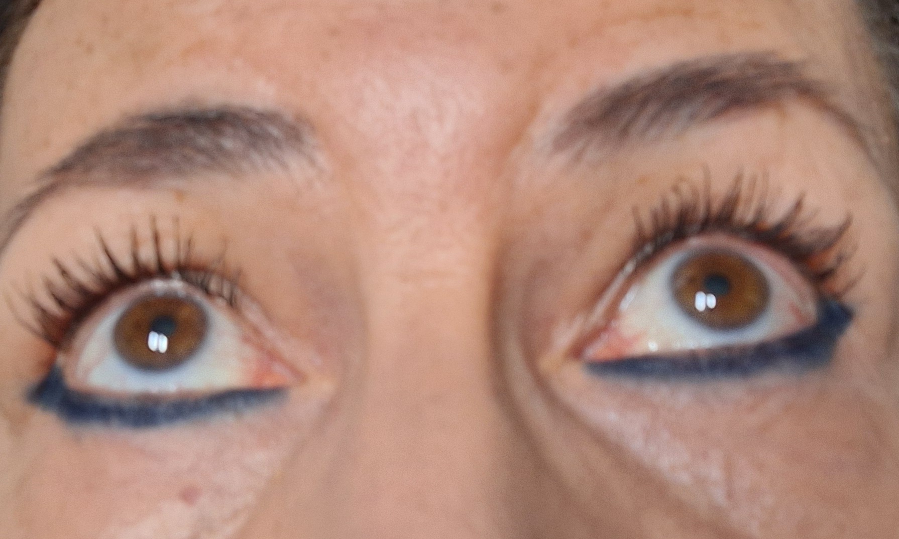 Both eyes after a lash lift, lashes lifted and defined